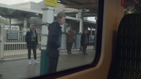 Train-arriving-at-station-awaiting-passengers