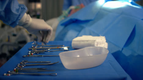 CU-Medical-Assistant-Picks-Up-Surgical-Scissors