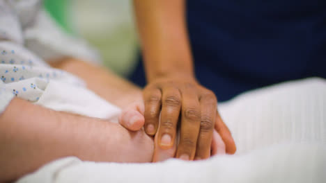 CU-Nurse-Holding-Patient-Hand
