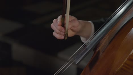 Close-Up-Of-A-Male-Cellist-Performing