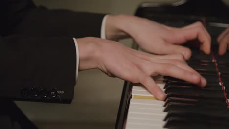 Close-Up-Hands-Of-Male-Pianist-Playing-The-Piano