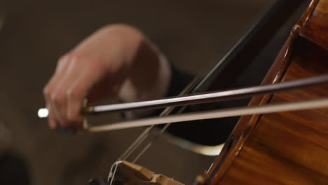 Extreme-Close-Up-Of-Bow-On-Cello-Strings