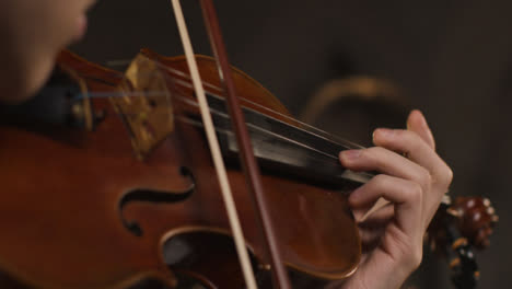 Close-Up-Pan-Down-Of-Violinist-Playing-Violin
