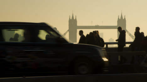 Pedestrians-and-traffic-crossing-busy-London-Bridge