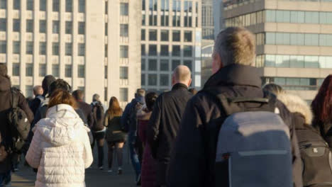 Pedestrians-Walking-Away-From-Camera--On-Busy-Street