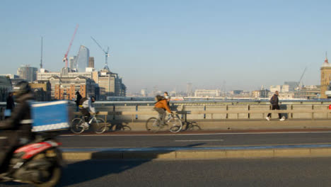 Pedestrians-And-Traffic-Crossing-Busy-Bridge