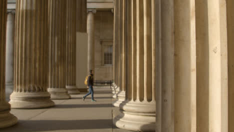Man-Walking-Through-Columns-at-British-Museum