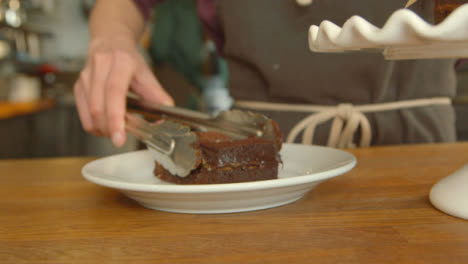Serving-a-Portion-of-Chocolate-Brownie-Cake