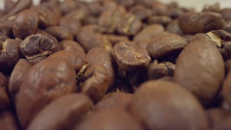 Close-Up-of-Coffee-Beans-Dropping-in-Front-of-Camera