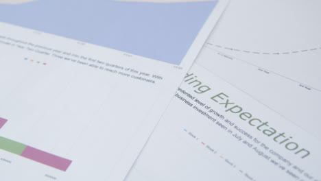 Close-Up-Business-Reports-and-Analysis-on-Desk