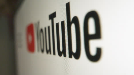 Close-Up-Pan-of-Youtube-Logo-on-Screen