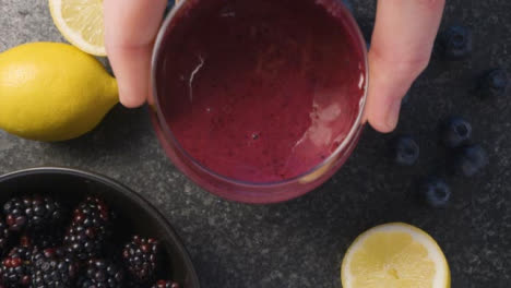 Overhead-Pouring-Berry-Smoothie-into-Glass