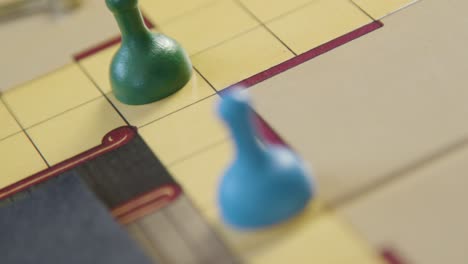 Hand-Rolling-Die-and-Moving-Pawn-in-Cluedo-Game