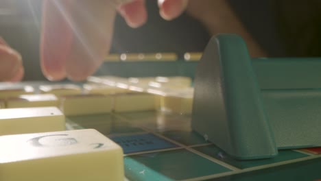 Close-Up-Two-People-Playing-Board-Game-Scrabble