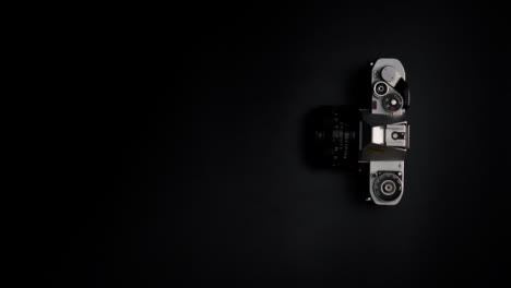 Flat-Lay-Retro-Camera-On-Flat-Surface-Left-Copy-Space