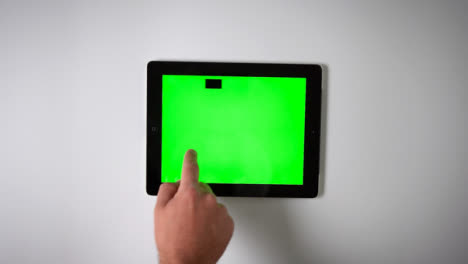 Flat-Lay-Tablet-Green-Screen-Finger-Scrolling-Left
