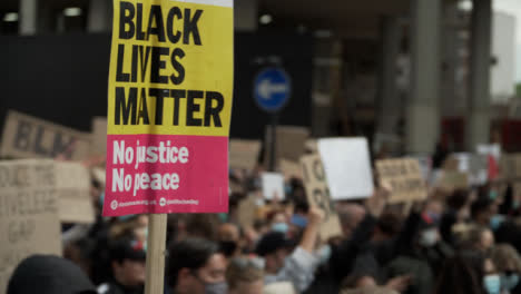 A-BLM-Sign-Being-Marched-Through-London-Crowd-of-Protestors