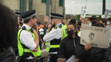 London-Protesters-Walk-Past-Police-During-March
