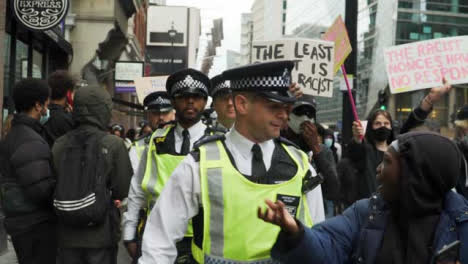 London-Protester-Talking-to-Police-Officer-During-March