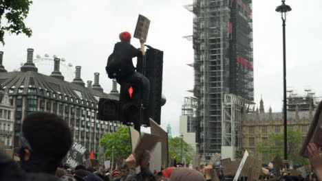 London-Black-Lives-Matter-Protester-Sitting-On-Traffic-Light