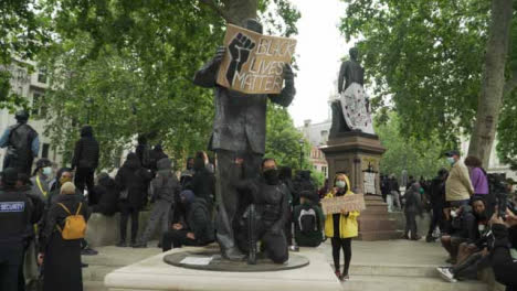 London-Black-Lives-Matter-Protester-Poses-by-Nelson-Mandela-Statue