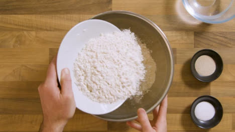 Top-View-Pouring-Flour-in-Bowl