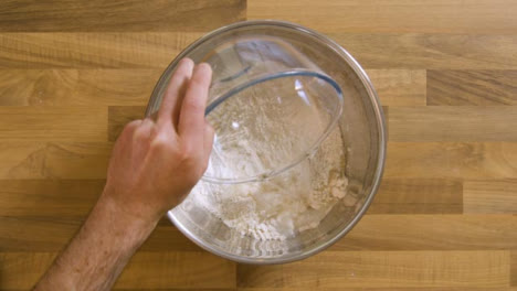 Top-View-Pouring-Water-into-Bowl