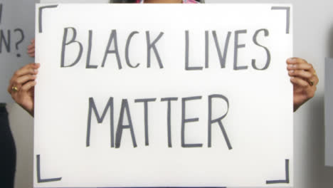 Close-Up-of-Woman-Holding-Black-Lives-Matter-Sign