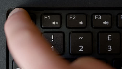 Top-View-Finger-Pressing-Esc-Button-Keyboard