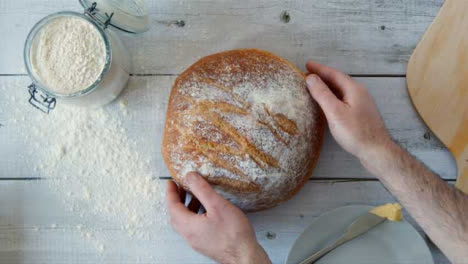 Top-View-Hands-Picking-Up-Bread-from-Table