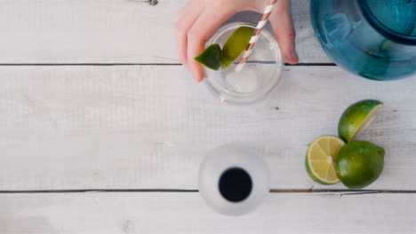 Top-view-Hand-Putting-Straw-in-Drink