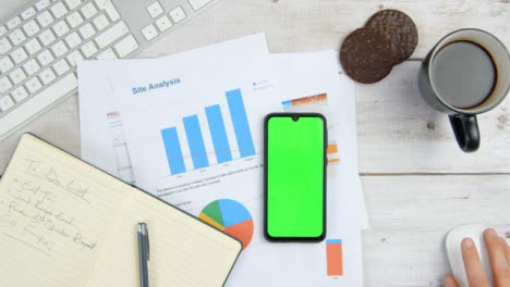 Top-View-Male-Hands-Using-Computer-and-Phone-Green-Screen