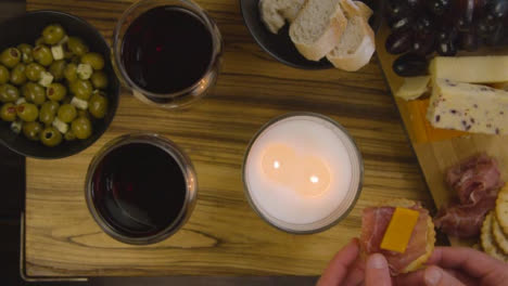 Two-People-Enjoying-an-Evening-Meal-with-Cheese-Board-and-Red-Wine-02