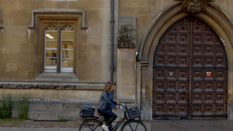 Wide-Shot-of-Cyclists-Riding-Past-Bodleian-Library-In-Oxford