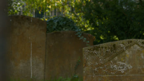 Pull-Focus-Shot-of-Tombstones-In-Oxford-Graveyard