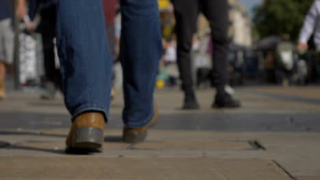 Defocused-Shot-of-Feet-Walking-Down-Cornmarket-Street-In-Oxford-