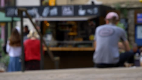 Defocused-Shot-of-Young-Girls-at-Outdoor-Coffee-Stall-In-Oxford-