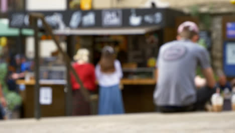 Defocused-Shot-of-Young-Girls-at-Outdoor-Coffee-Stall-In-Oxford-England-01