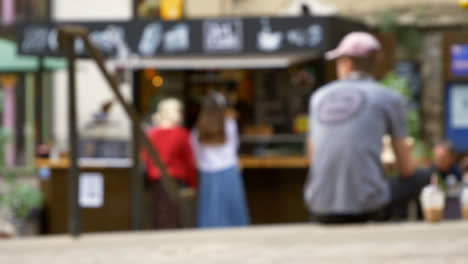 Defocused-Shot-of-Young-Girls-at-Outdoor-Coffee-Stall-In-Oxford-England-02