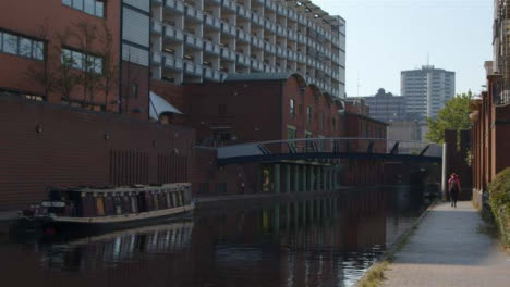 Tracking-Shot-of-Someone-Walking-Alongside-Canal-In-Birmingham-