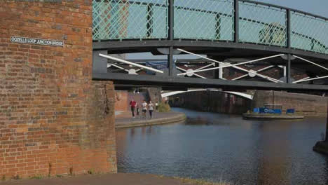 Panning-Shot-of-Runners-Alongside-a-Canal-In-Birmingham