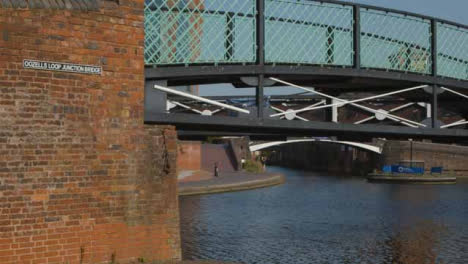 Panning-Shot-of-a-Runner-Alongside-Canal-In-Birmingham