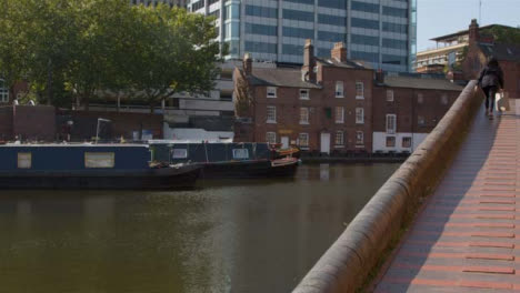 Panning-Shot-of-Canal-Boats-Moored-In-Birmingham-Canal-