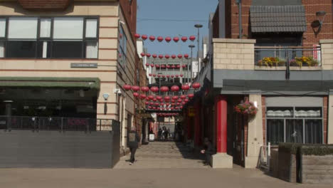Wide-Shot-of-Narrow-Street-with-Chinese-Lantern-Decorations