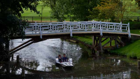 Wide-Shot-of-Two-People-In-Peddle-Boat-On-River-In-Oxford