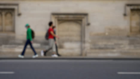 Defocused-Shot-of-People-and-Traffic-Travelling-Down-High-Street-In-Oxford-02