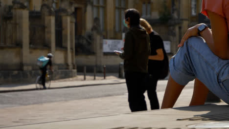 Wide-Shot-of-People-Socialising-On-Street-as-Traffic-Goes-By-In-Oxford-01