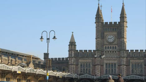 Panning-Shot-of-People-Standing-In-Front-of-Bristol-Temple-Meads-Station-