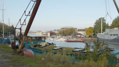 Rising-Shot-of-Rusted-Crane-Next-to-Río-In-Bristol-England