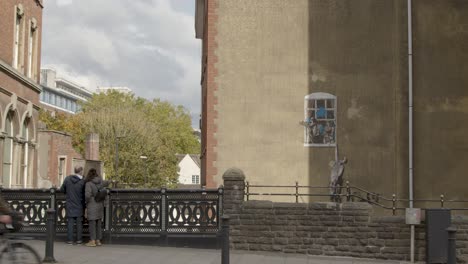 Wide-Shot-of-Banksy-Artwork-In-Bristol-City-Centre-In-England